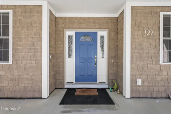 a living room with furniture fireplace and rug