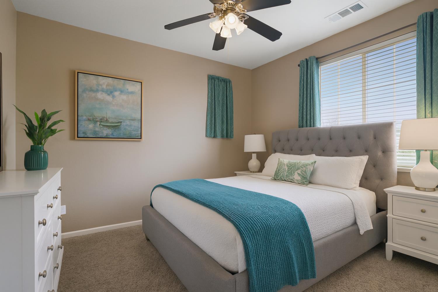 10148 Tony Court Stockton, CA 95209 - Photo 8 of 12 a bedroom with a large bed and a chandelier