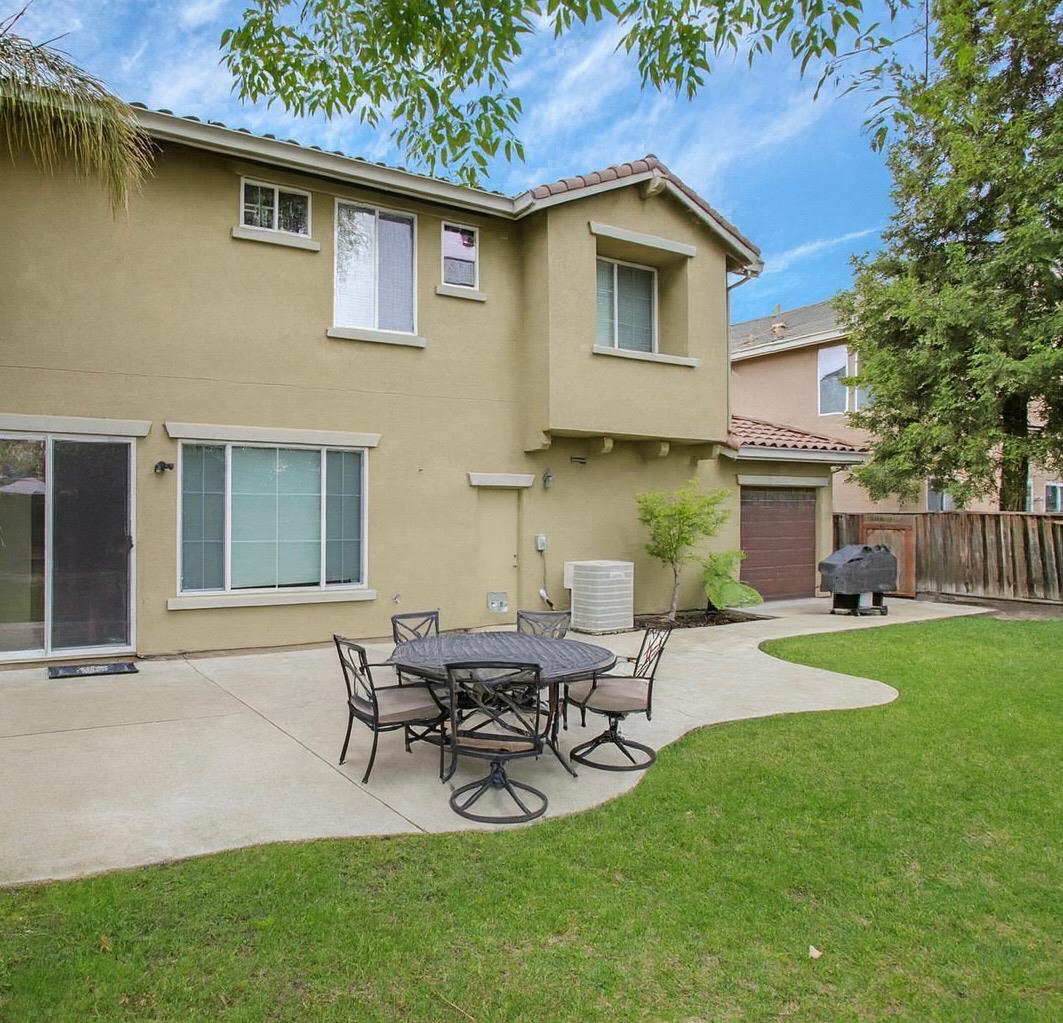 10148 Tony Court Stockton, CA 95209 - Photo 10 of 12 a view of an house with backyard space and patio