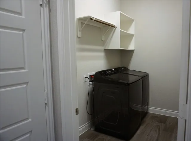 a view of storage and utility room with washer and dryer