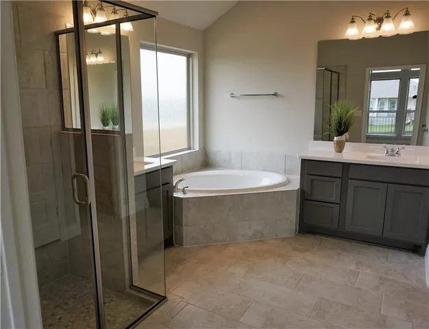 a bathroom with a bathtub and a sink