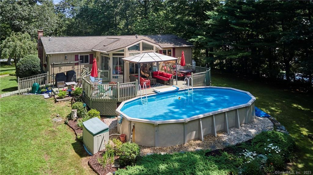 a view of a chairs and table in the patio