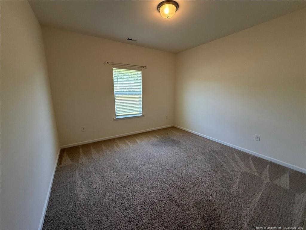 240 Planters Lane Coats, NC 27521 - Photo 9 of 18 an empty room with a window