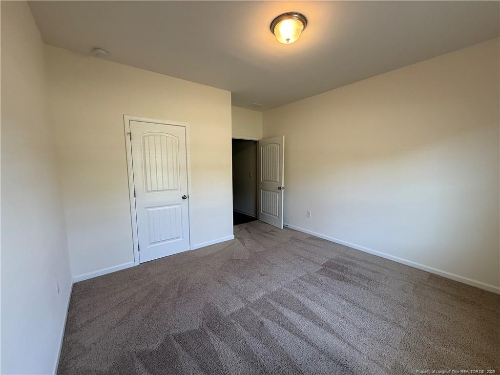 240 Planters Lane Coats, NC 27521 - Photo 10 of 18 an empty room with an entryway
