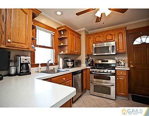1982 Oak Tree Road Edison, NJ 08820 - Photo 2 of 25 a kitchen with stainless steel appliances granite countertop a refrigerator a stove top oven a sink and dishwasher