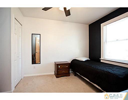 1982 Oak Tree Road Edison, NJ 08820 - Photo 12 of 25 a bedroom with a bed and a window