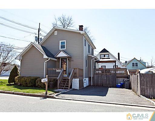 1982 Oak Tree Road Edison, NJ 08820 - Photo 23 of 25 a front view of a house with garage