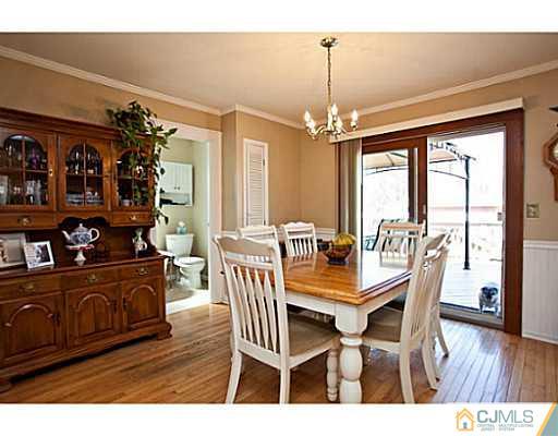 1982 Oak Tree Road Edison, NJ 08820 - Photo 5 of 25 a view of a dining room with furniture window and wooden floor