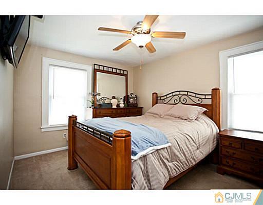 1982 Oak Tree Road Edison, NJ 08820 - Photo 6 of 25 a bedroom with a bed and window
