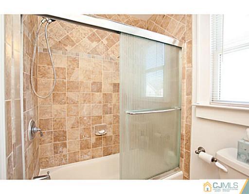 1982 Oak Tree Road Edison, NJ 08820 - Photo 10 of 25 a bathroom with a shower and a sink
