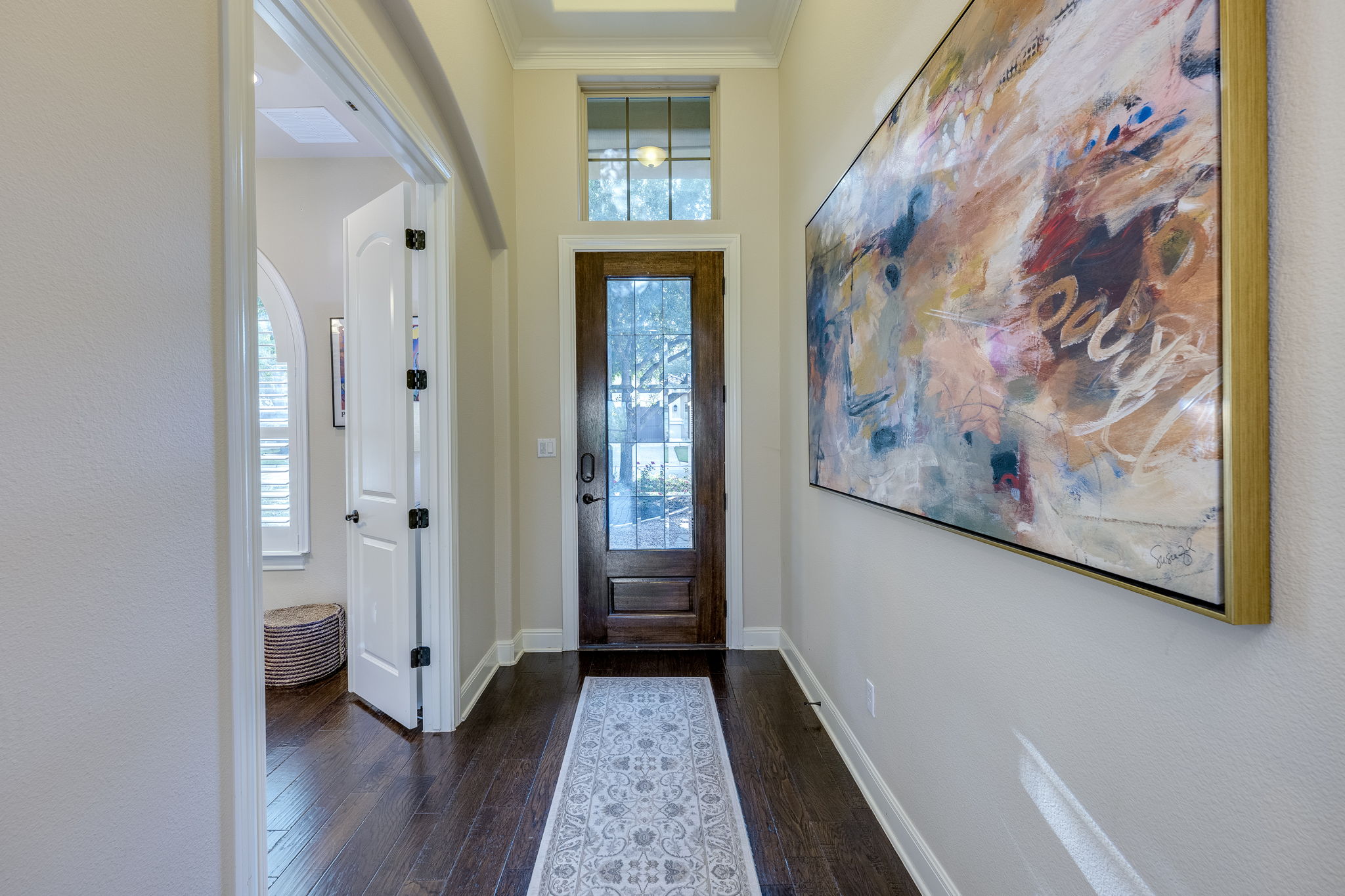 11601 Shadestone Terrace Austin, TX 78732 - Photo 13 of 40 a view of a hallway with wooden floor and closet
