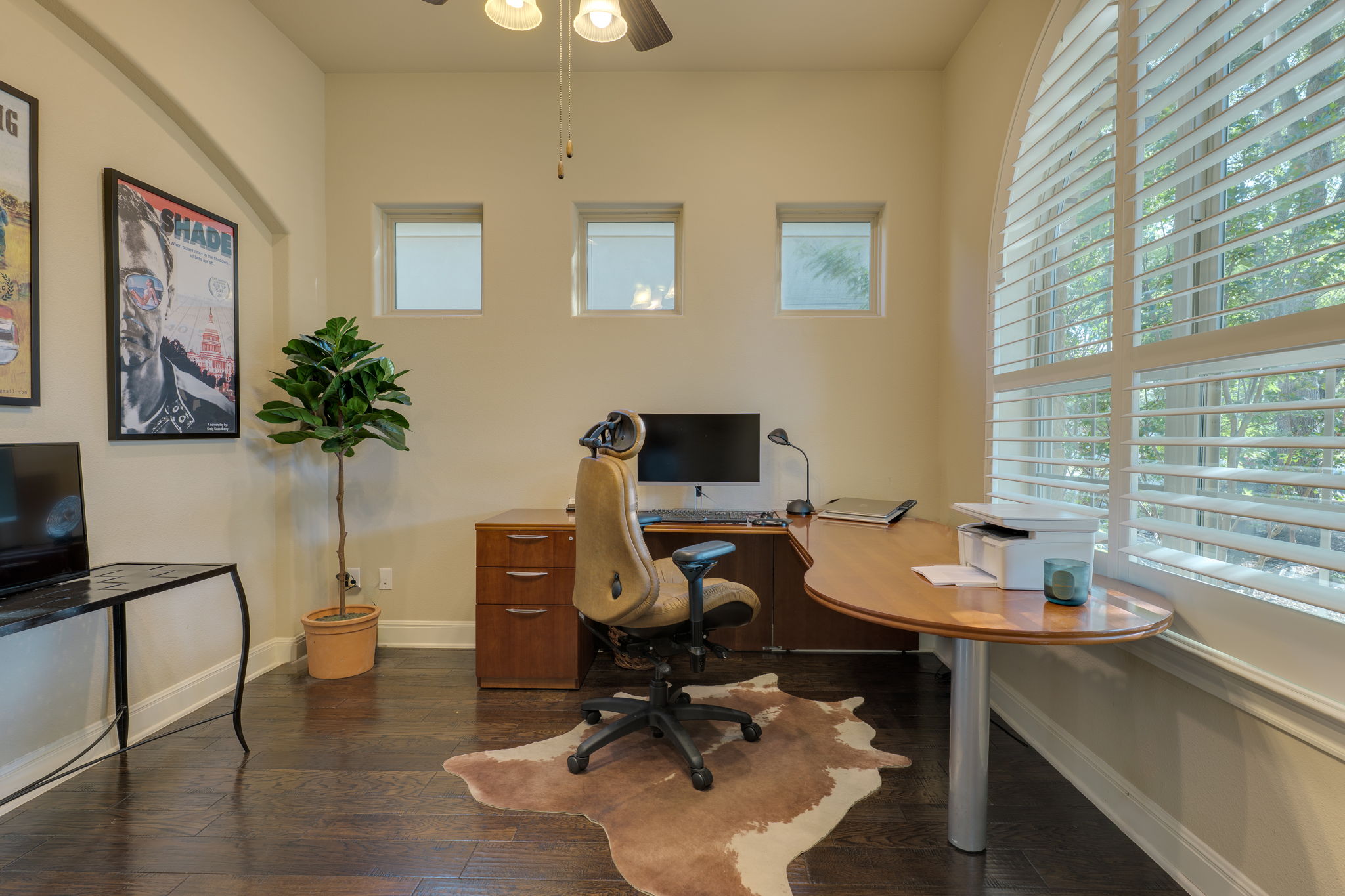 11601 Shadestone Terrace Austin, TX 78732 - Photo 14 of 40 a view of a workspace with furniture and a potted plant