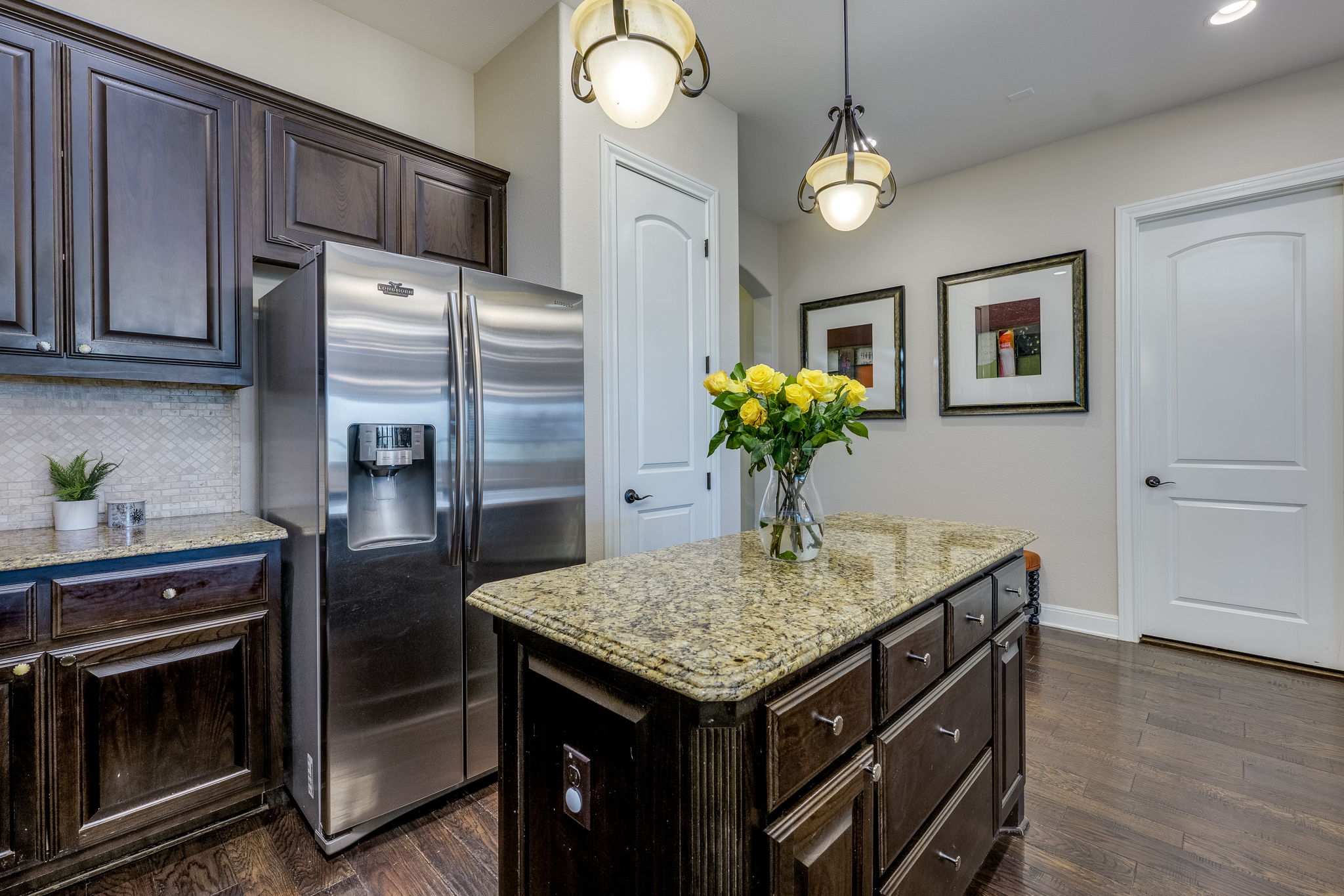 11601 Shadestone Terrace Austin, TX 78732 - Photo 19 of 40 a kitchen with stainless steel appliances granite countertop a refrigerator and a stove top oven