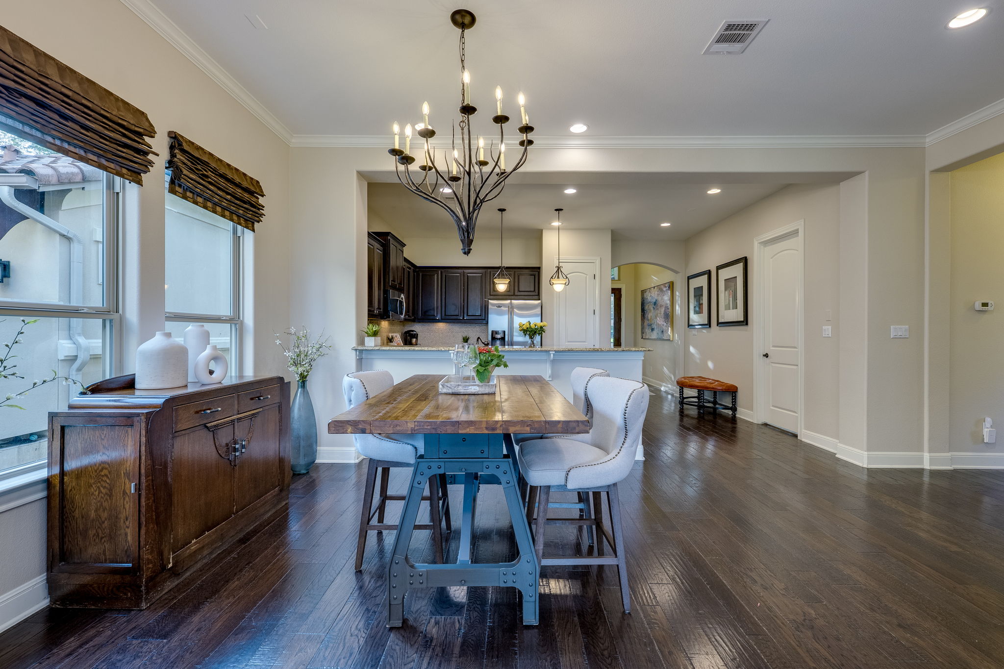 11601 Shadestone Terrace Austin, TX 78732 - Photo 20 of 40 a view of a dining room with furniture and wooden floor