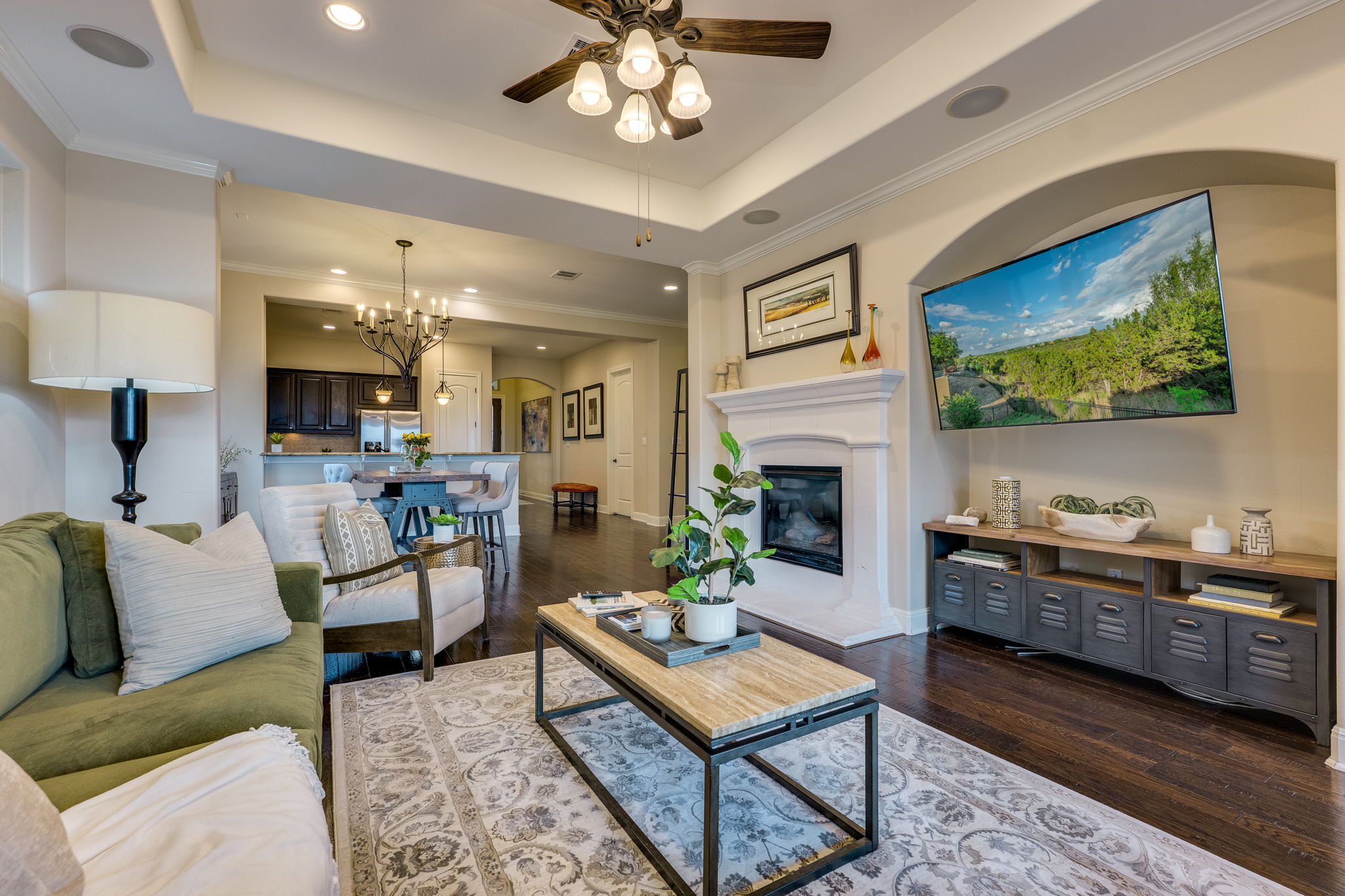 11601 Shadestone Terrace Austin, TX 78732 - Photo 22 of 40 a living room with furniture a fireplace and a flat screen tv