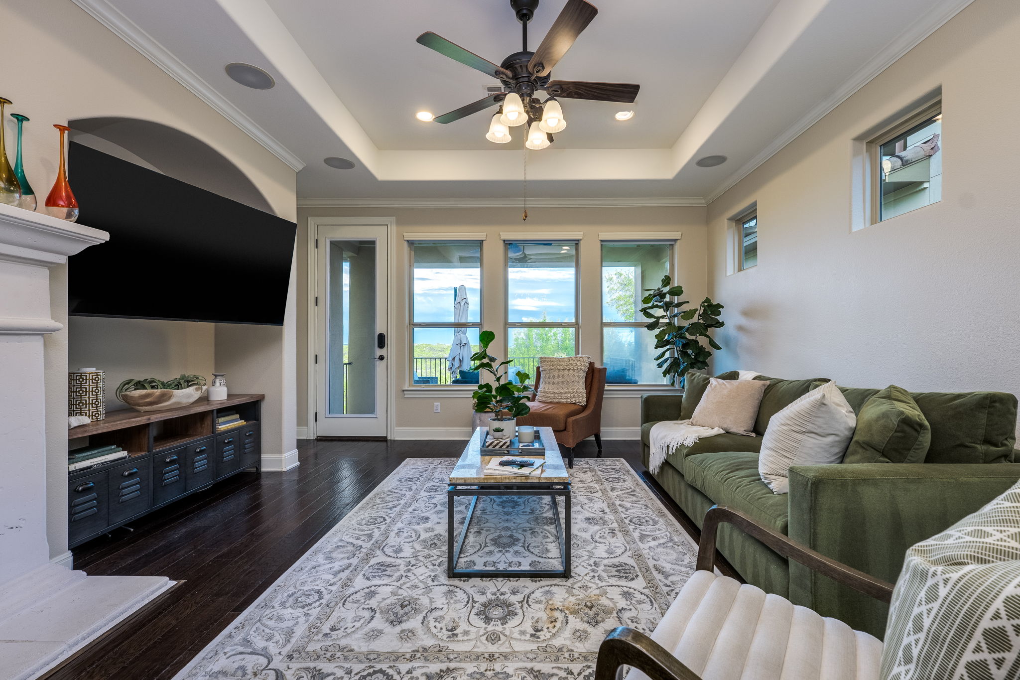 11601 Shadestone Terrace Austin, TX 78732 - Photo 24 of 40 a living room with furniture fireplace and a flat screen tv