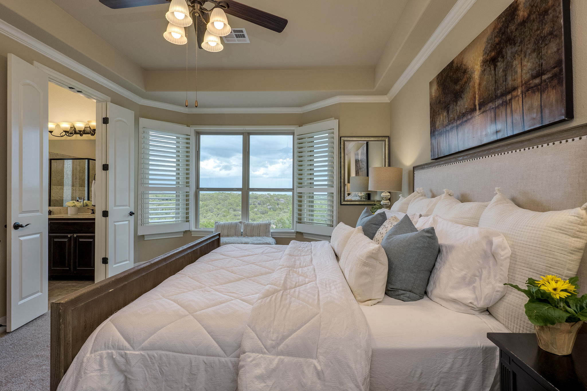 11601 Shadestone Terrace Austin, TX 78732 - Photo 27 of 40 a large bed sitting in a bedroom next to a window