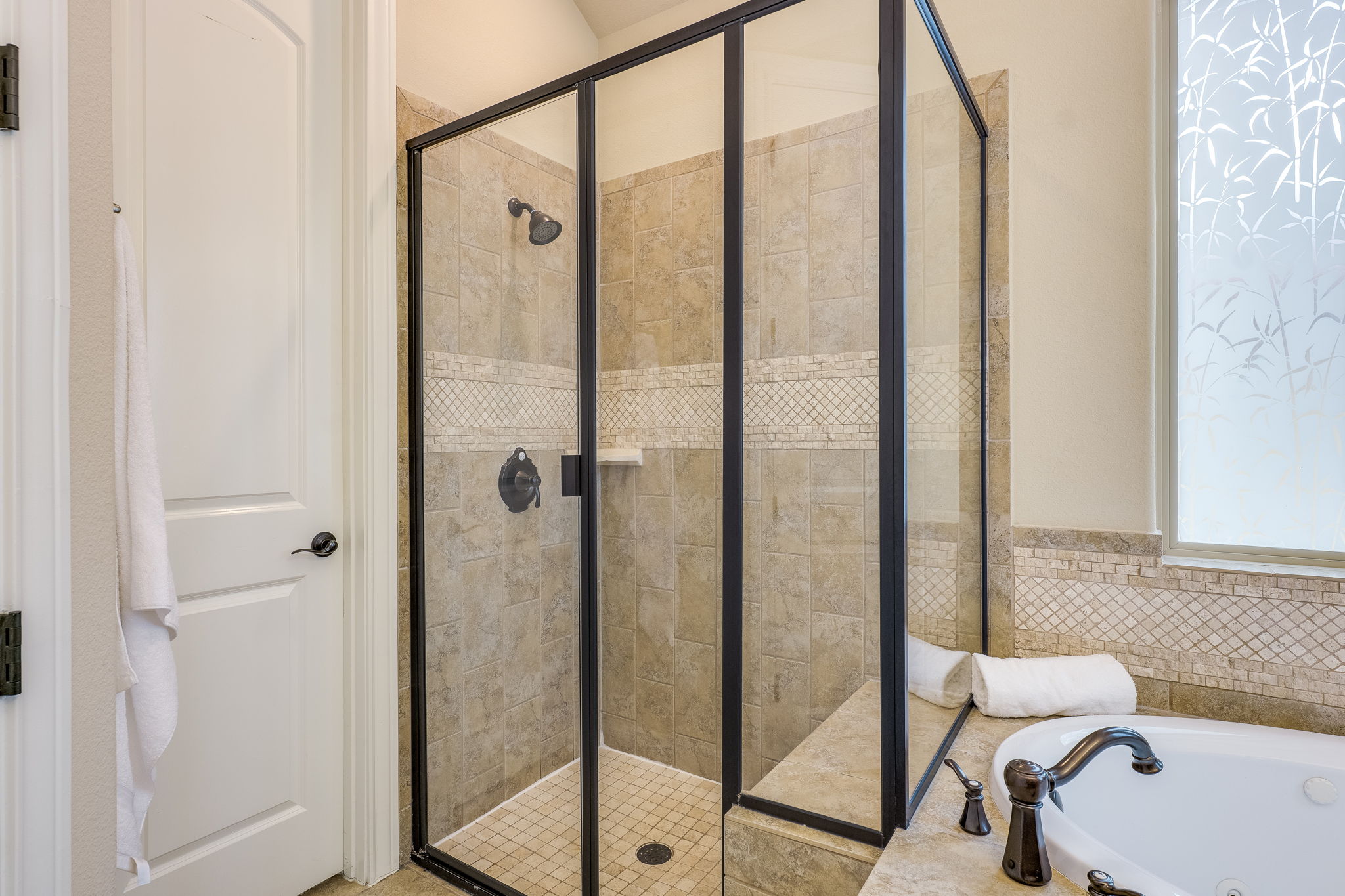 11601 Shadestone Terrace Austin, TX 78732 - Photo 31 of 40 a bathroom with a shower and toilet
