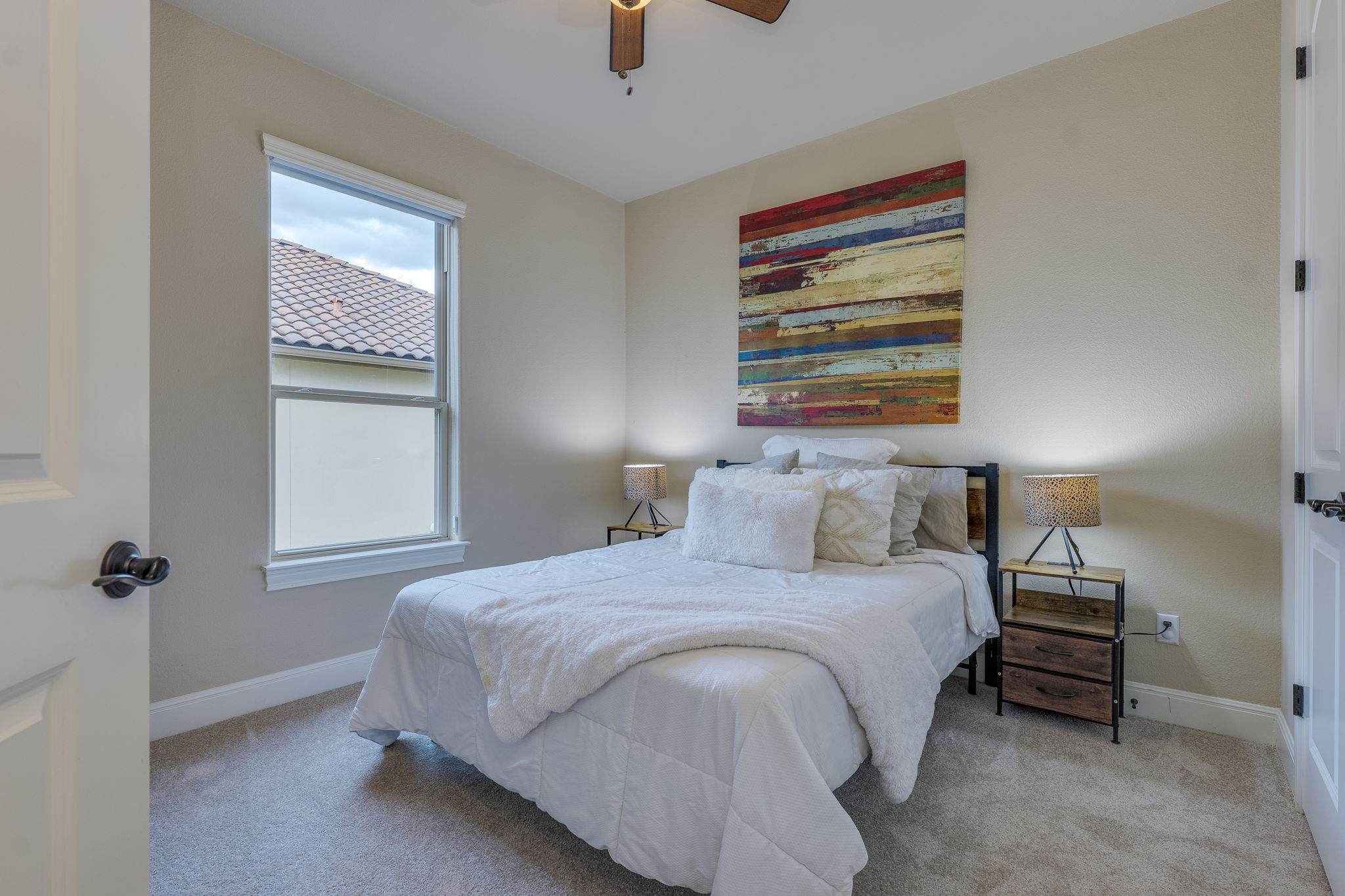 11601 Shadestone Terrace Austin, TX 78732 - Photo 34 of 40 a bedroom with a bed and a window