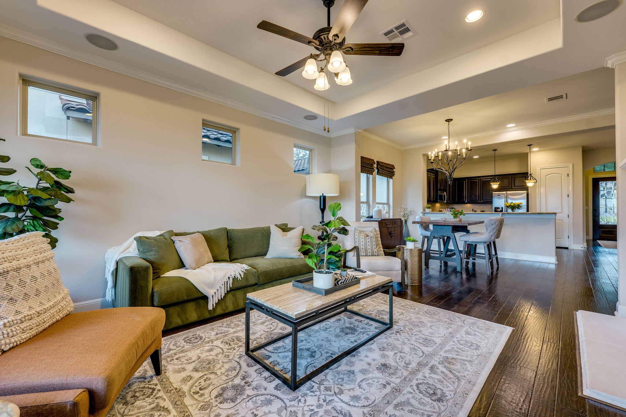 11601 Shadestone Terrace Austin, TX 78732 - Photo 6 of 40 a living room with furniture a chandelier and a rug