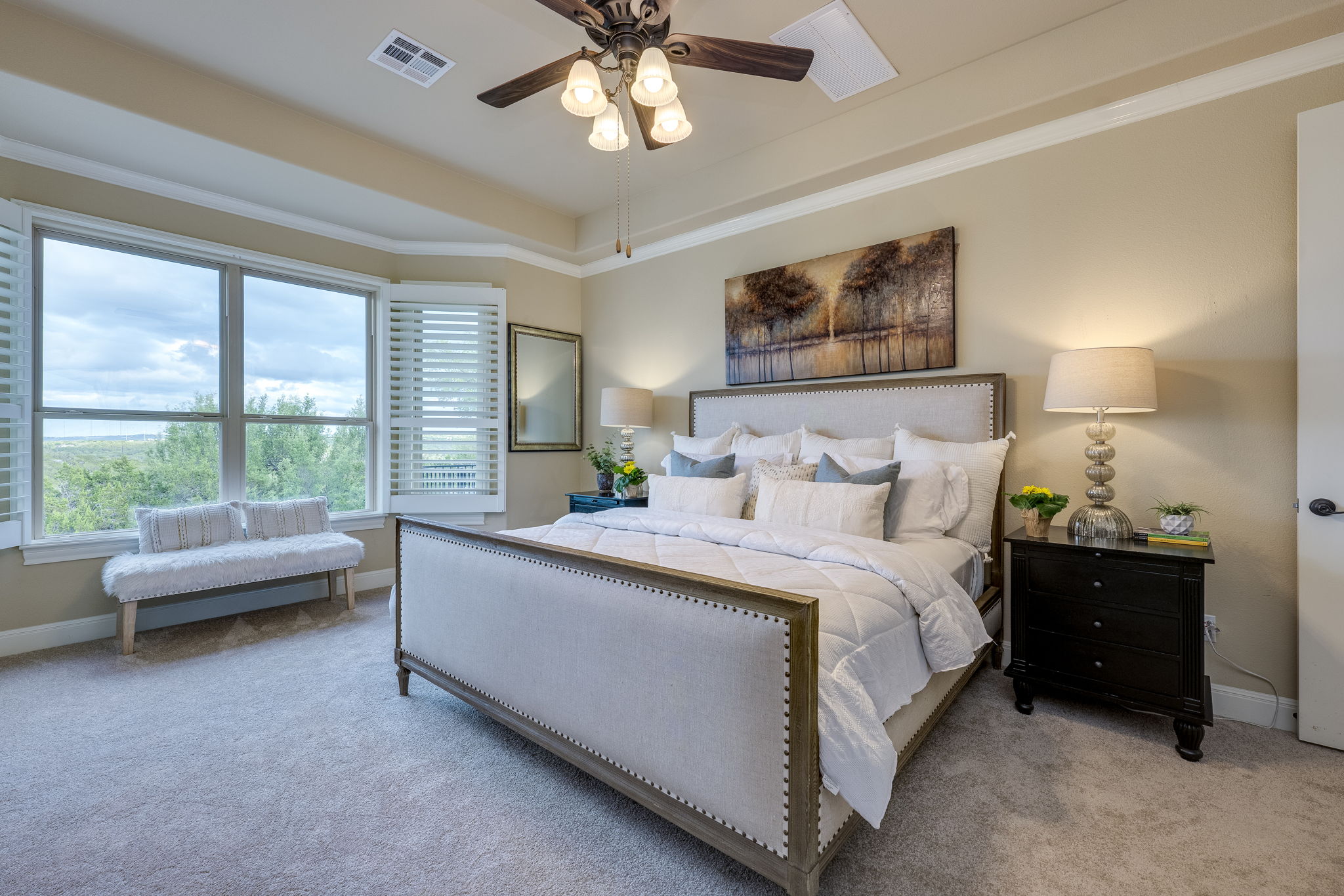 11601 Shadestone Terrace Austin, TX 78732 - Photo 10 of 40 a spacious bedroom with a bed and a large window