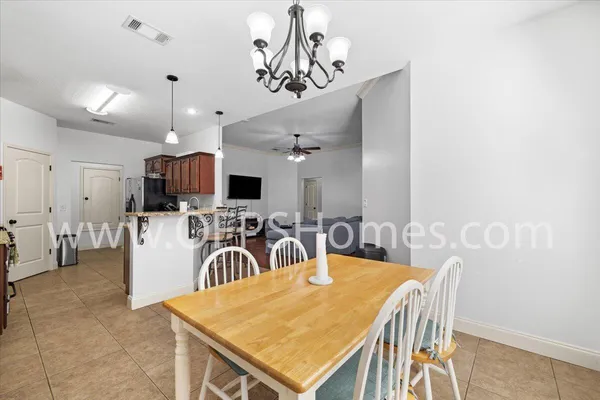 a view of a dining room with furniture