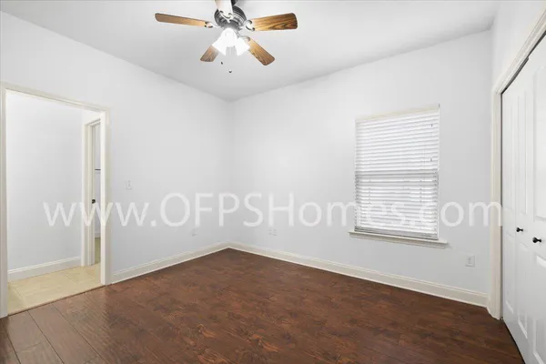 a view of an empty room with a window