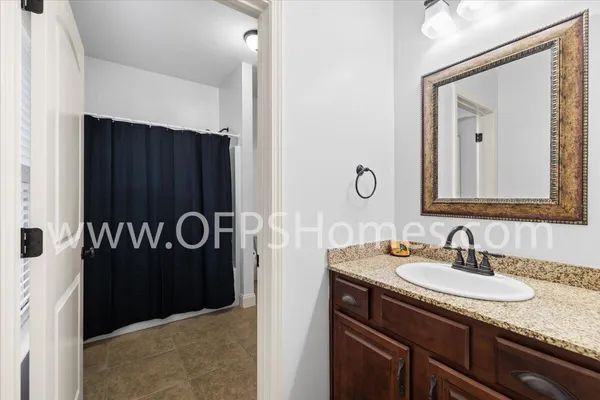 a bathroom with a sink and mirror