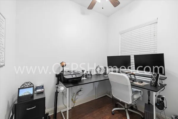 a view of a workspace with furniture
