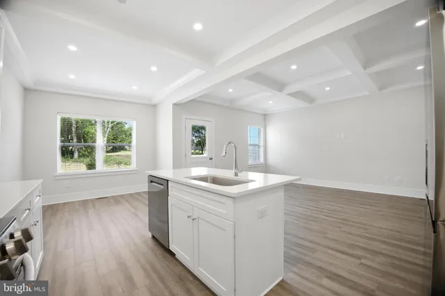 a kitchen with a sink and window