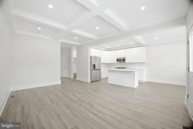 a view of kitchen with wooden floor
