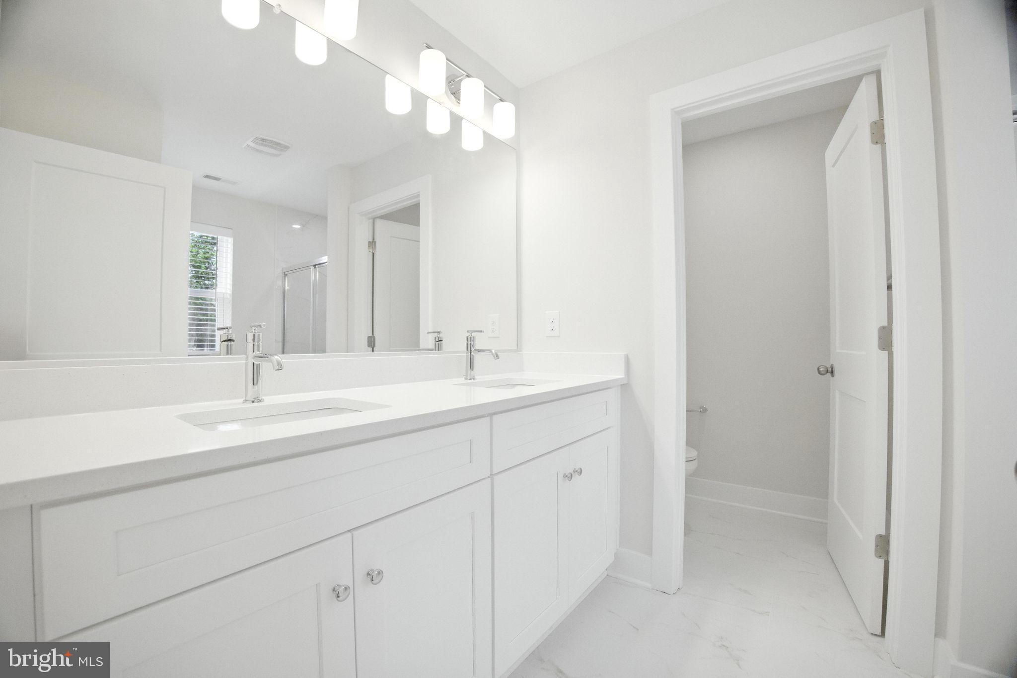 43 Sequoia Drive Berlin, NJ 08009 - Photo 20 of 40 a bathroom with 2 sink and a mirror