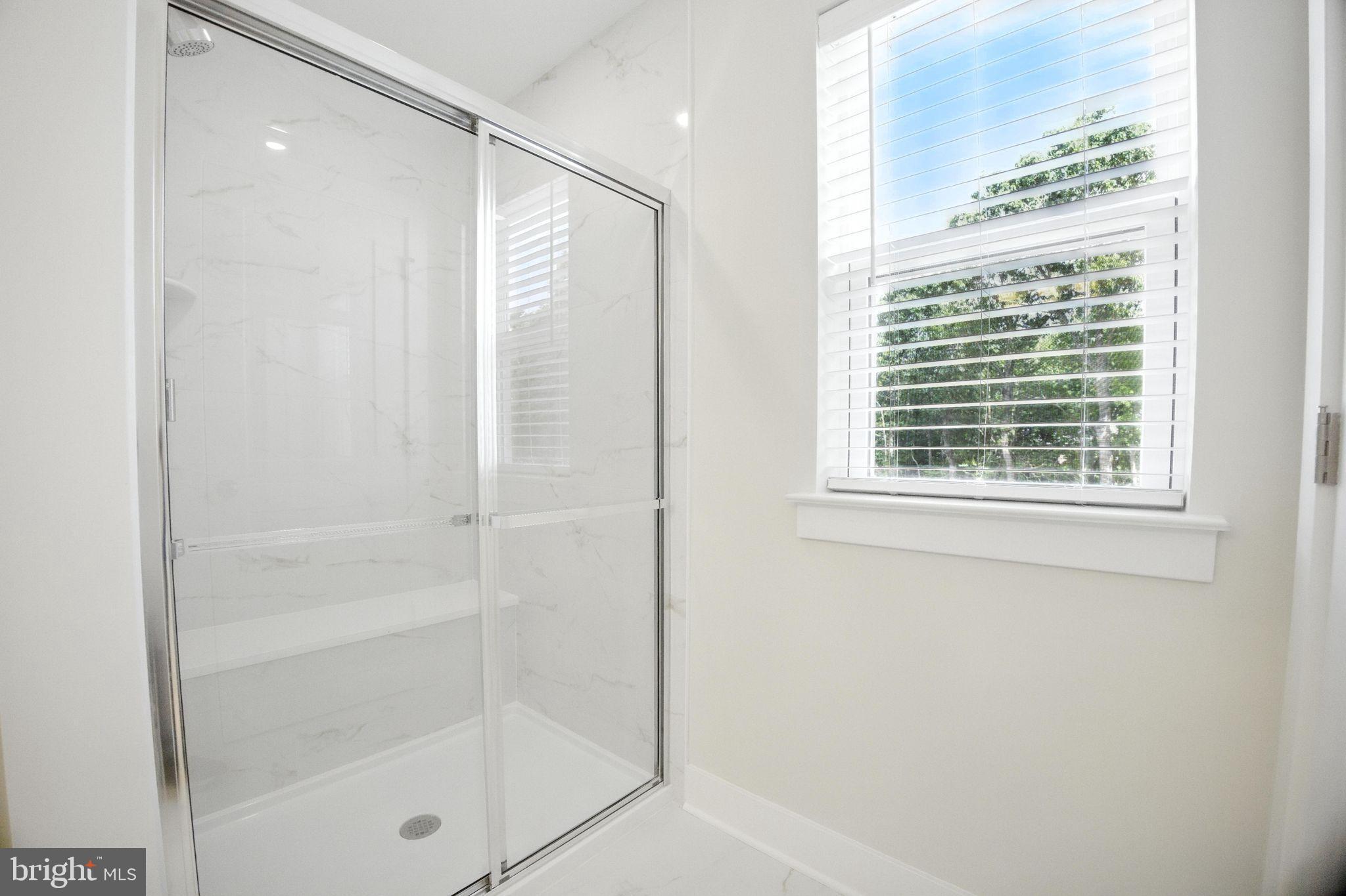 43 Sequoia Drive Berlin, NJ 08009 - Photo 21 of 40 a bathroom with a glass shower door