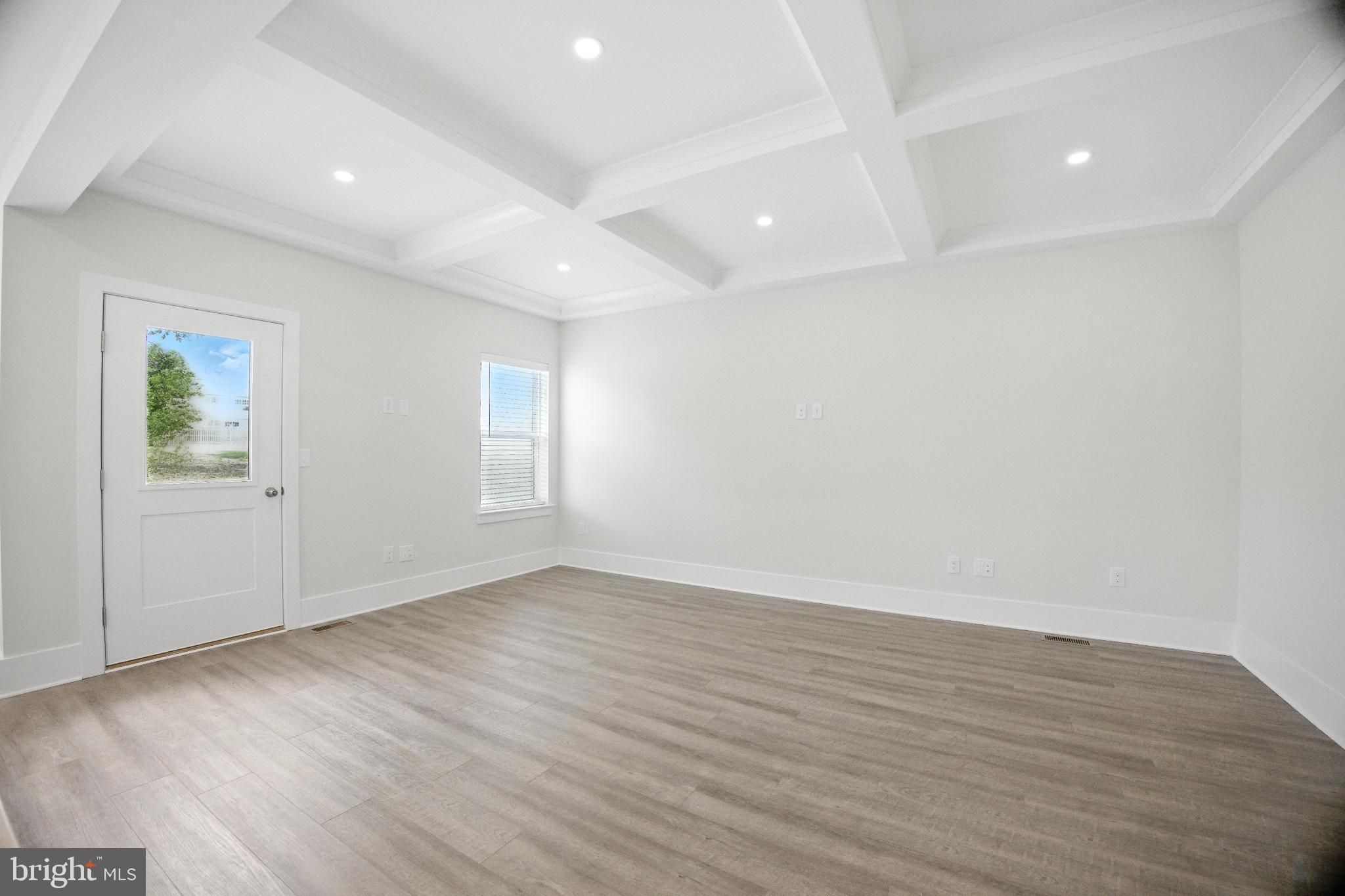 43 Sequoia Drive Berlin, NJ 08009 - Photo 27 of 40 an empty room with wooden floor and windows
