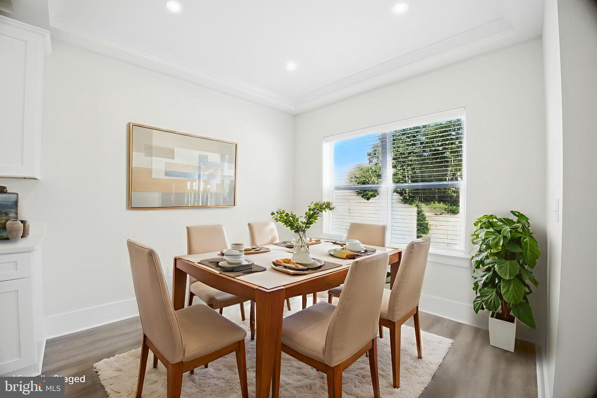 43 Sequoia Drive Berlin, NJ 08009 - Photo 33 of 40 a dining room with furniture potted plants and wooden floor