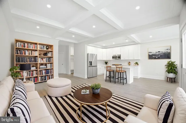a bedroom with furniture and a flat screen television