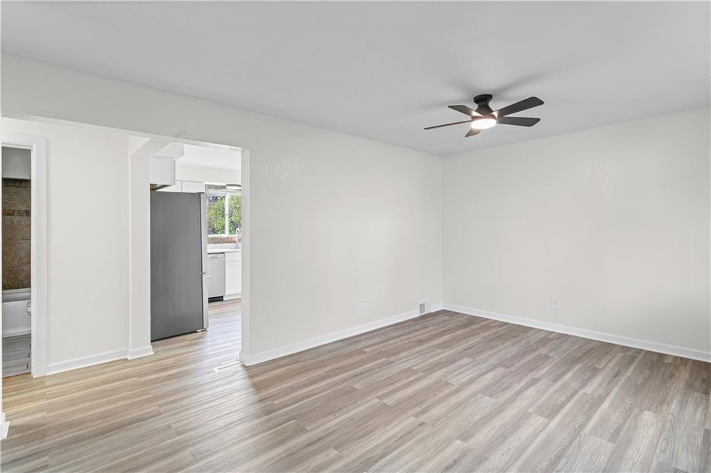 1305 Main Street Bridgeville, PA 15017 - Photo 11 of 50 wooden floor in an empty room with a window
