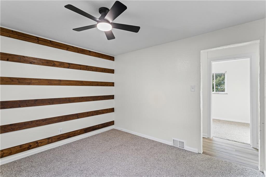 1305 Main Street Bridgeville, PA 15017 - Photo 18 of 50 a view of an empty room with a ceiling fan