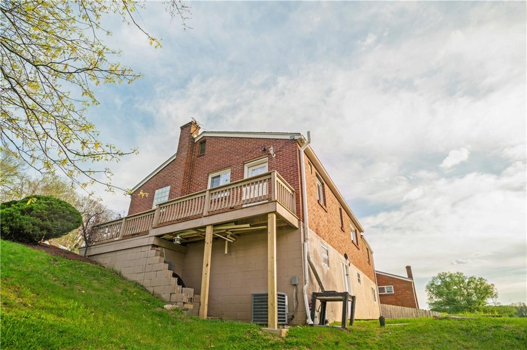1305 Main Street Bridgeville, PA 15017 - Photo 39 of 50 a view of a big house with a big yard and large trees