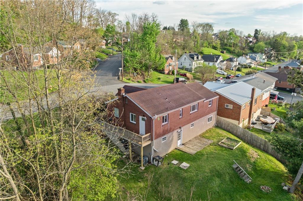 1305 Main Street Bridgeville, PA 15017 - Photo 42 of 50 a aerial view of a house next to a yard
