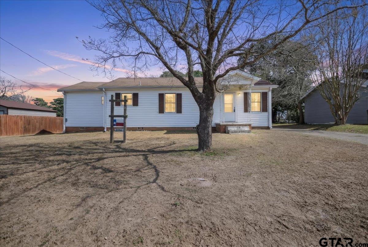 1706 Baxter Avenue Longview, TX 75602 - Photo 1 of 32 a house that has a tree in front of it