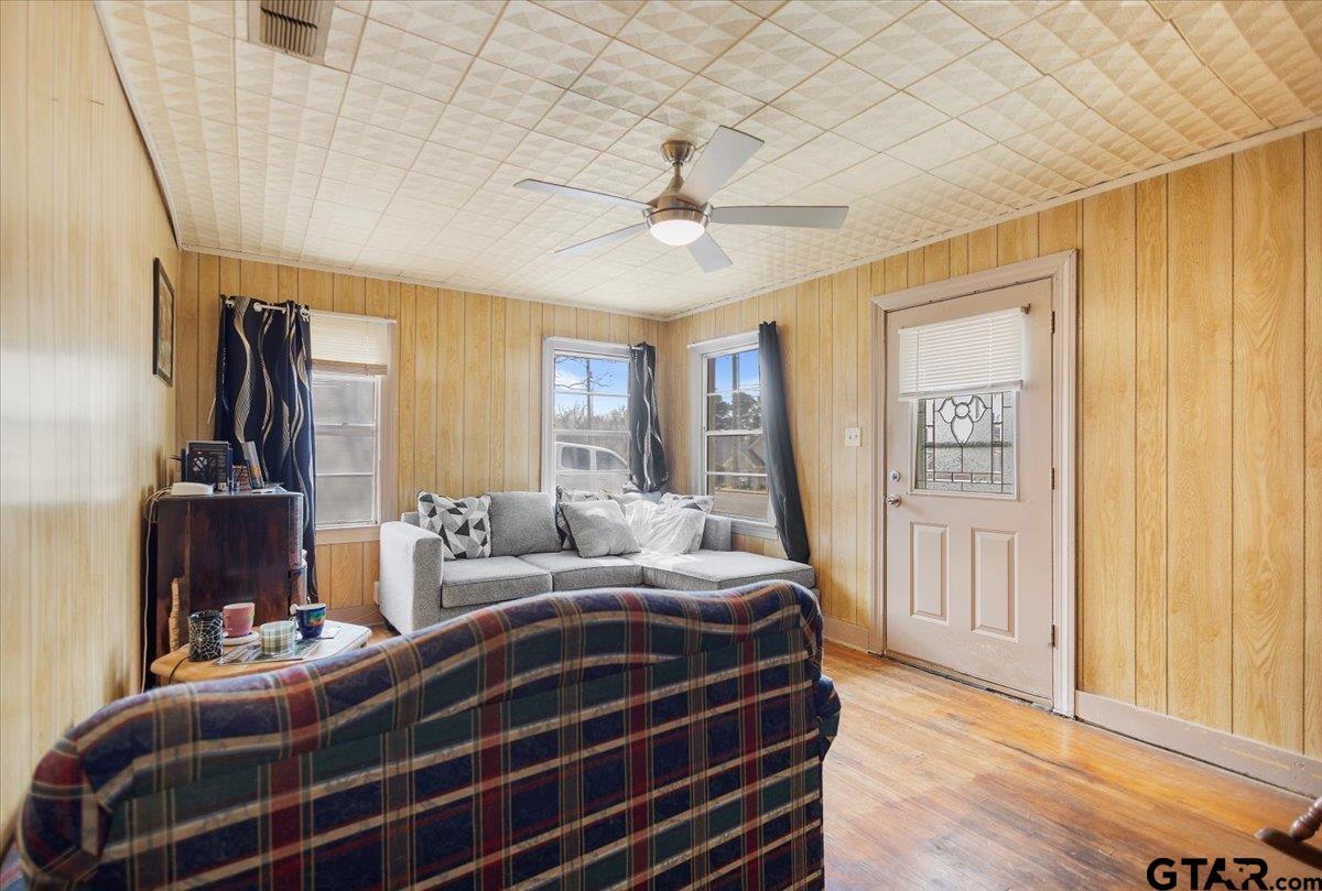1706 Baxter Avenue Longview, TX 75602 - Photo 14 of 32 a bedroom with bed and wooden floor