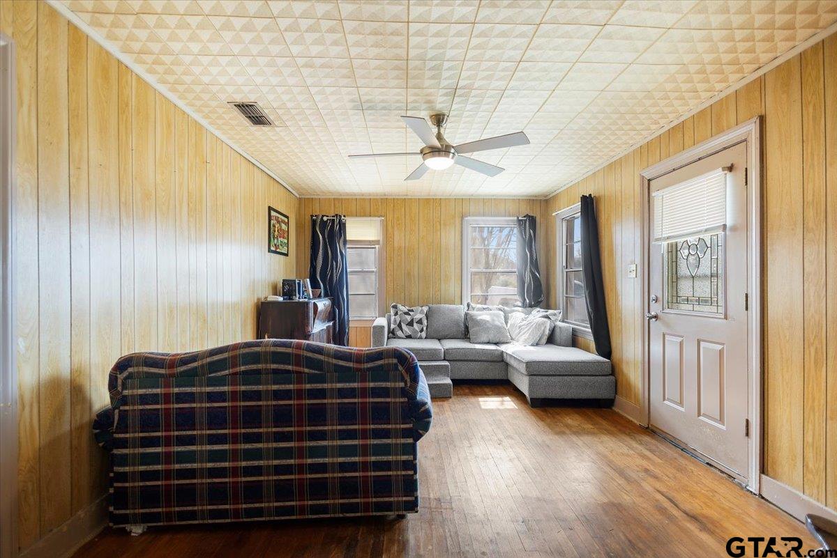 1706 Baxter Avenue Longview, TX 75602 - Photo 15 of 32 a bedroom with a bed and a chandelier