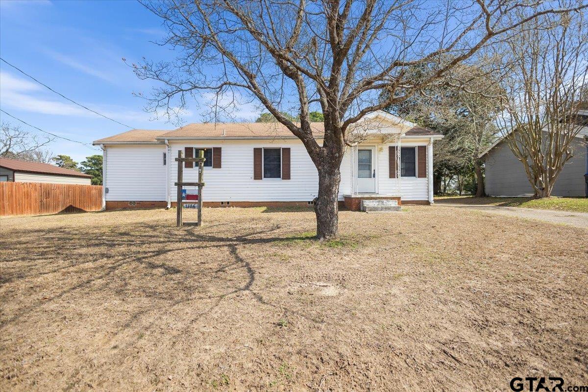 1706 Baxter Avenue Longview, TX 75602 - Photo 18 of 32 a view of a house with a yard