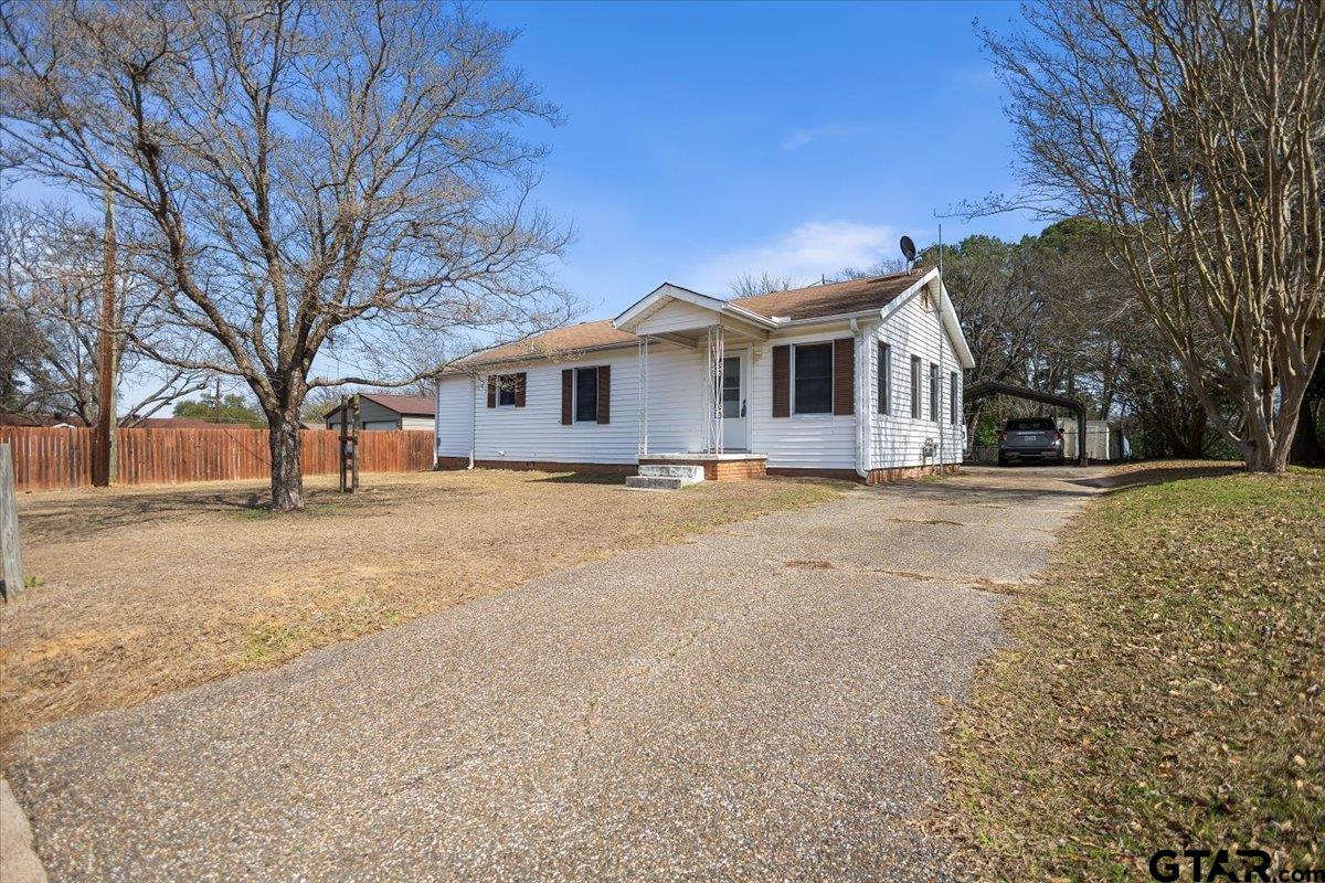 1706 Baxter Avenue Longview, TX 75602 - Photo 19 of 32 a front view of a house with a yard covered with snow