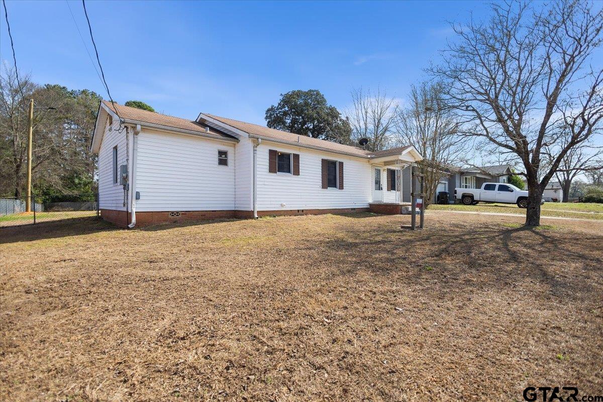 1706 Baxter Avenue Longview, TX 75602 - Photo 20 of 32 a front view of a house with a yard