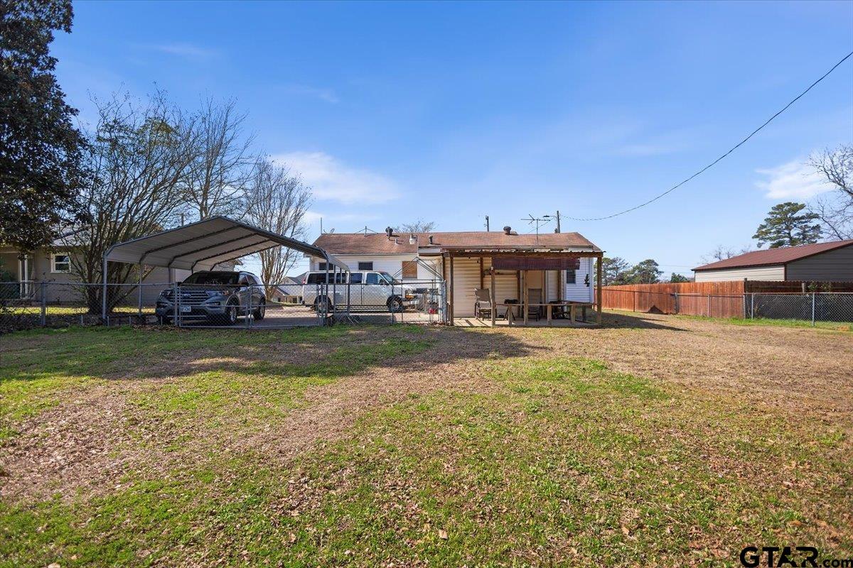 1706 Baxter Avenue Longview, TX 75602 - Photo 24 of 32 a front view of a house with swimming pool having outdoor seating