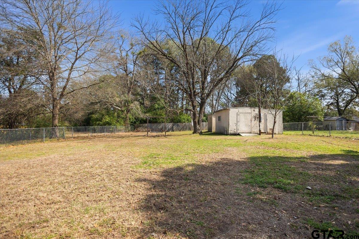 1706 Baxter Avenue Longview, TX 75602 - Photo 27 of 32 a view of a house with pool and a yard