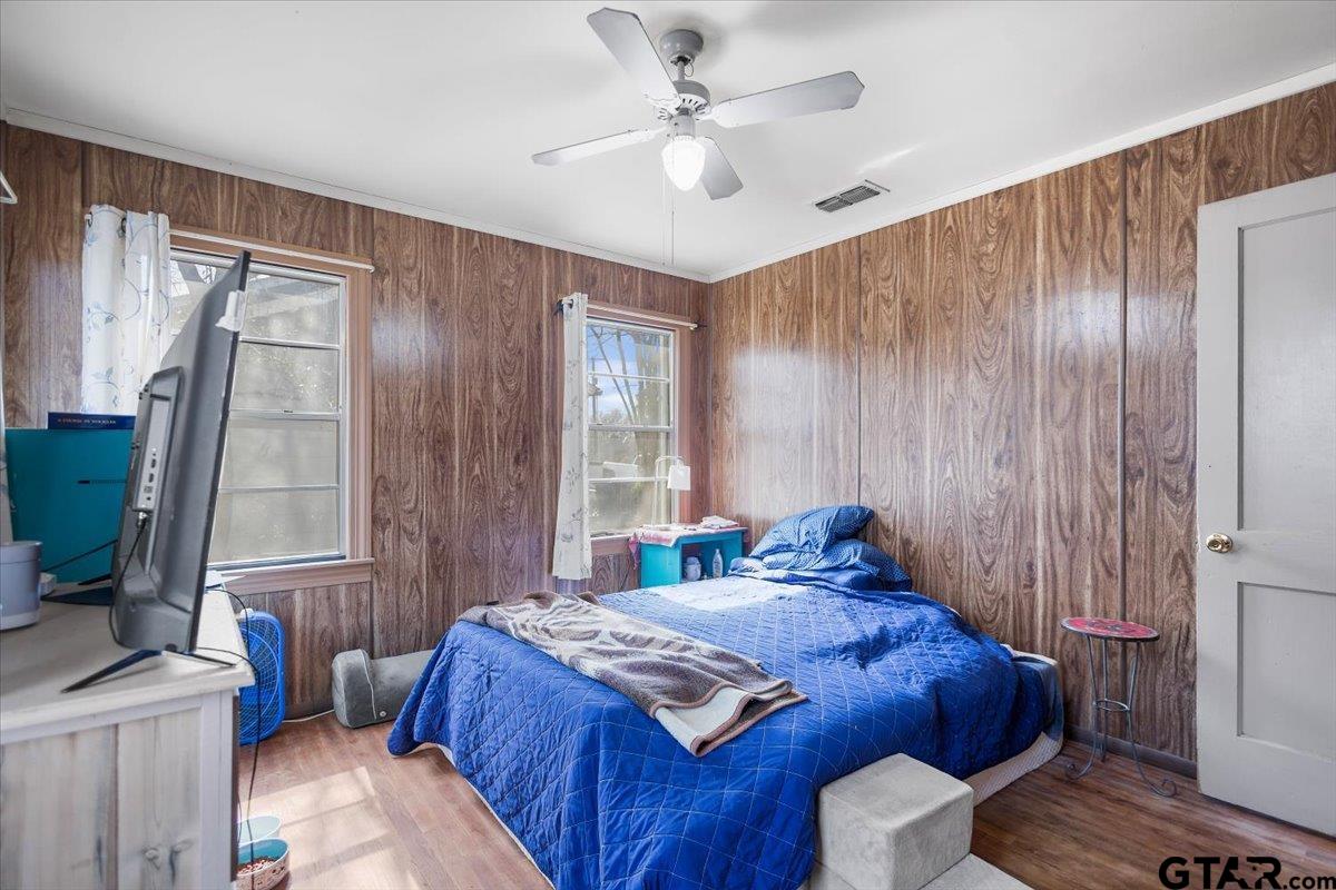 1706 Baxter Avenue Longview, TX 75602 - Photo 3 of 32 a bedroom with a bed dresser and a window