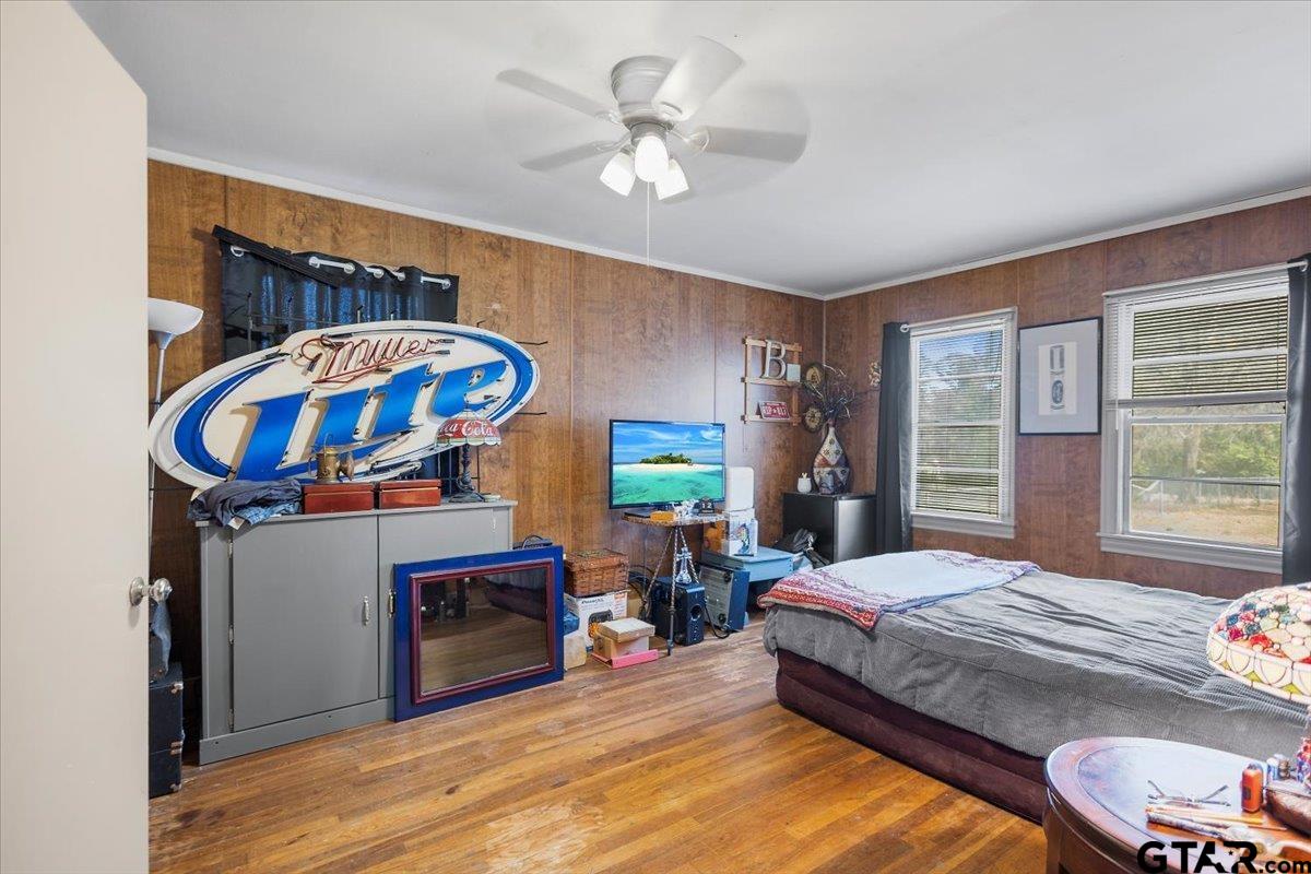 1706 Baxter Avenue Longview, TX 75602 - Photo 7 of 32 a bedroom with a bed and a fireplace